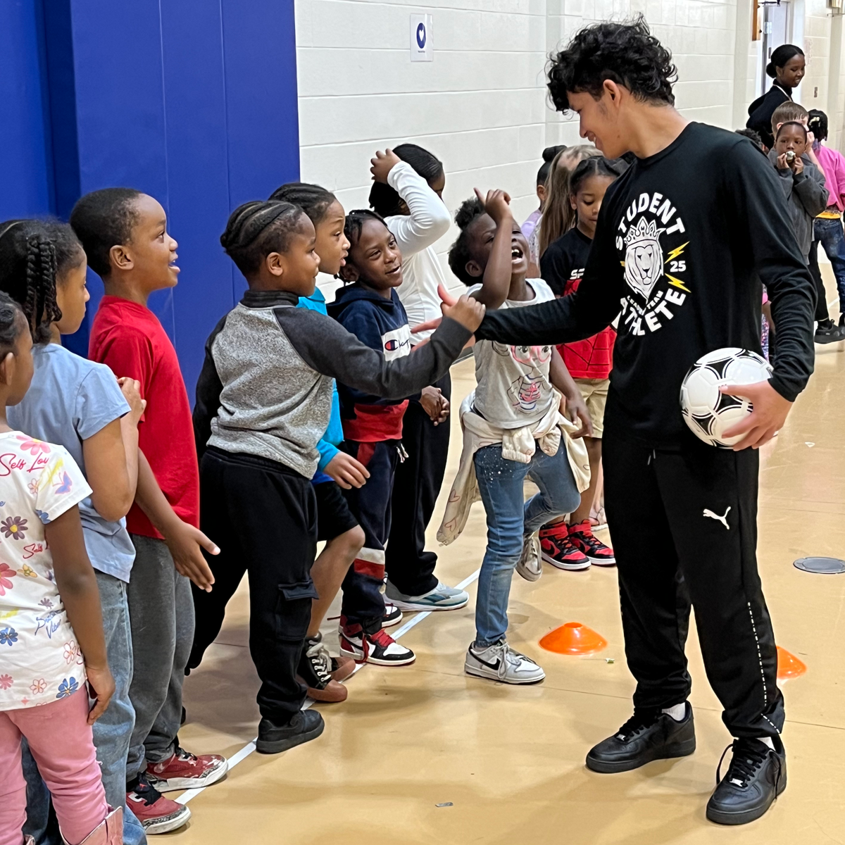 Members of the KIPP Indy Legacy's SALT program run a clinic for youth in their community