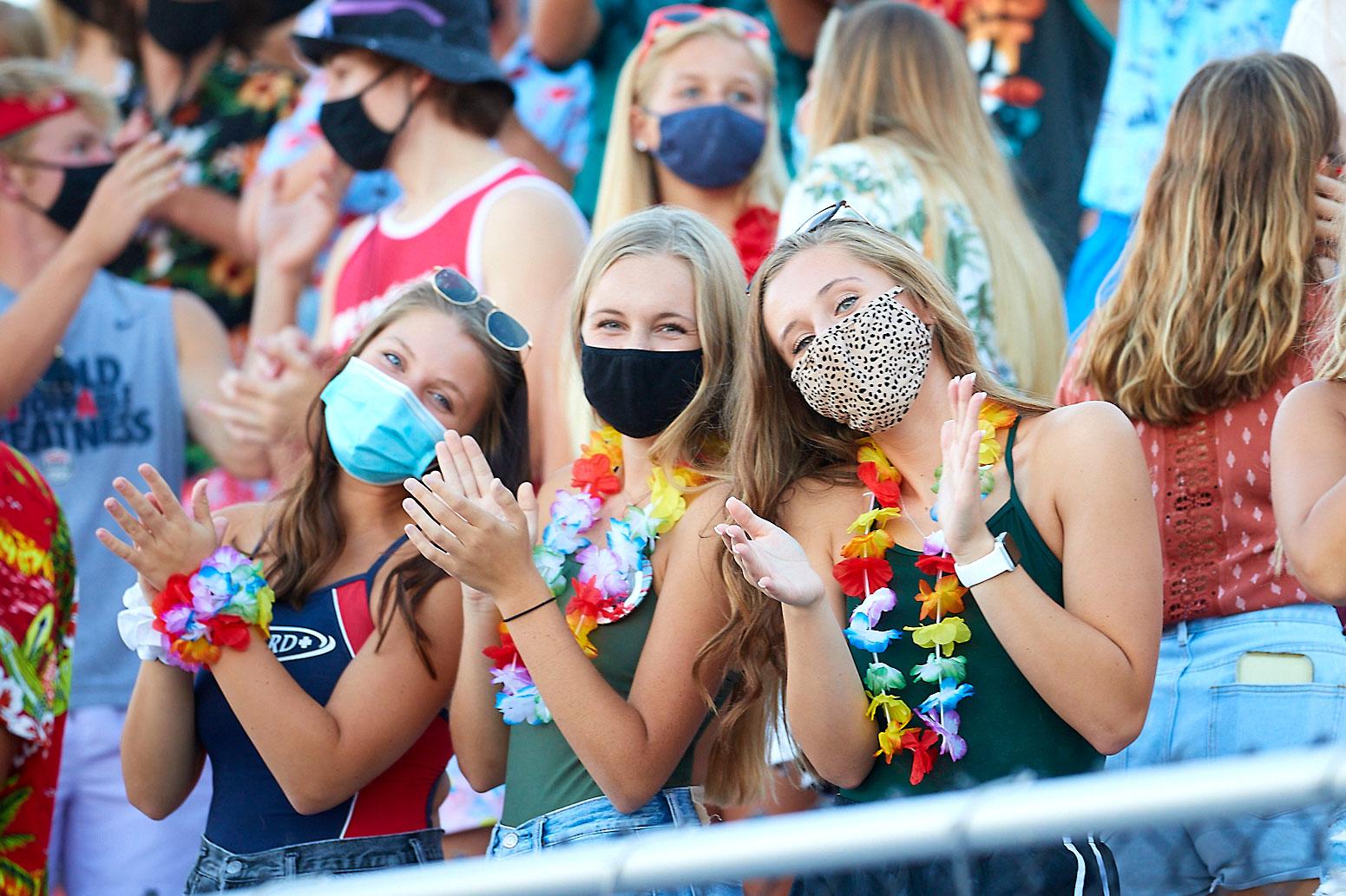 Image of fans with masks gathered for an IHSAA game.