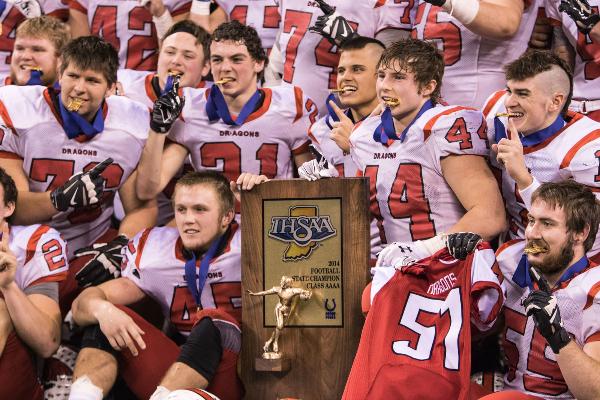 The New Palestine Dragons pose with their Class 4A championship medals and trophy.